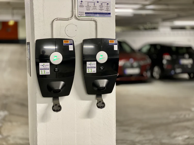 Two EV chargers installed in a parking garage